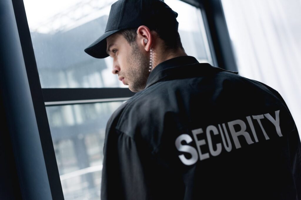 Security officer wearing jacket with security label